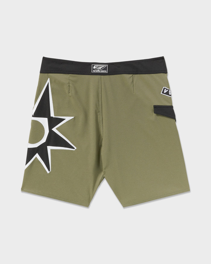 The Volcom Men's St4R G4Zer Mod 20 Trunks feature an olive green relaxed style, bold black and white starburst graphic, black waistband with logo, and a small Velcro side pocket.