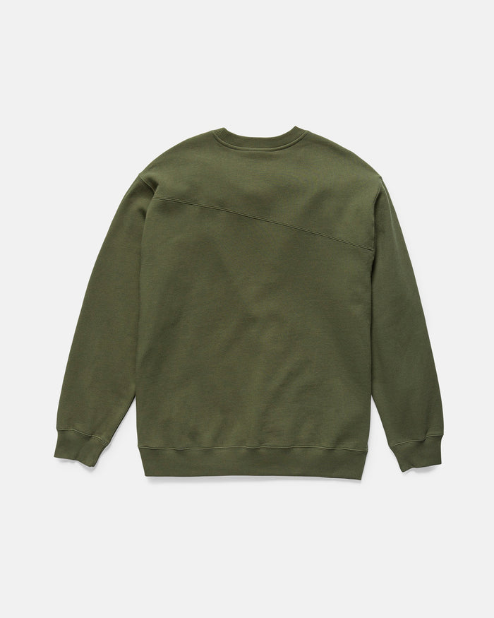 The Volcom Men's Stone Cruiser Crew in Squadron Green is shown from the back, featuring long sleeves, ribbed cuffs, a subtle diagonal seam across the upper back, and soft brushed fleece.