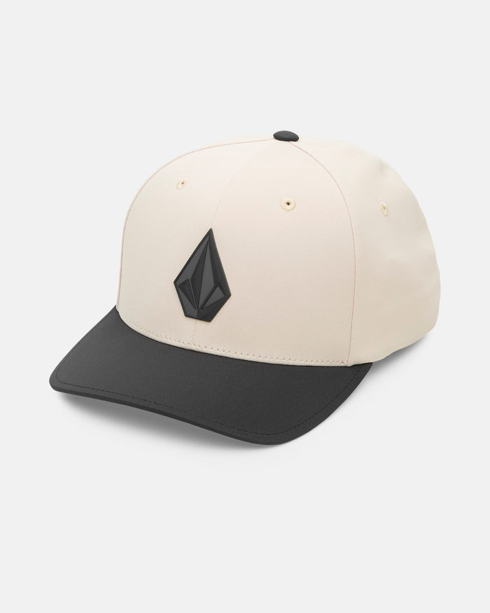 The Volcom Men's Stone Tech Flexfit Delta baseball cap in beige features a black brim, a black geometric logo, and moisture-wicking V.Co-Tech RESIST fabric, shown against a white background.