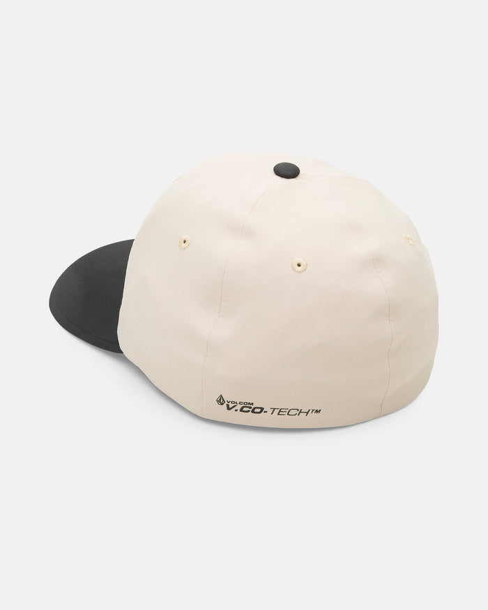 The Volcom Men's Stone Tech Flexfit Delta cap, shown from the back, has a white crown, black brim, small ventilation holes, and logo near the adjustable strap. Made with moisture-wicking fabric for comfort and lasting freshness.