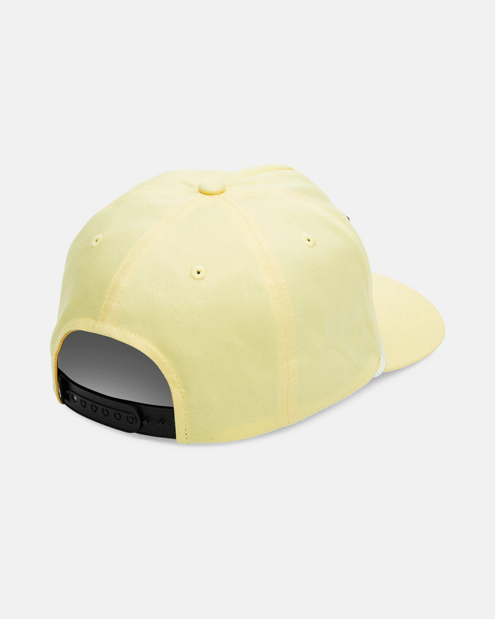 The Volcom Men's Stoney Mountain Hi Adjustable Hat is a light yellow 5-panel cap, shown from the back with a black snapback closure and ventilation eyelets on each panel.