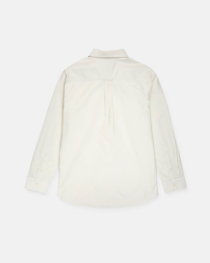 A men's Veeco Oxford Long Sleeve Shirt by Volcom is displayed laid flat with the back side facing up. This white button-up shirt features a classic fit, a collar, a back yoke with a center pleat, and buttoned cuffs.
