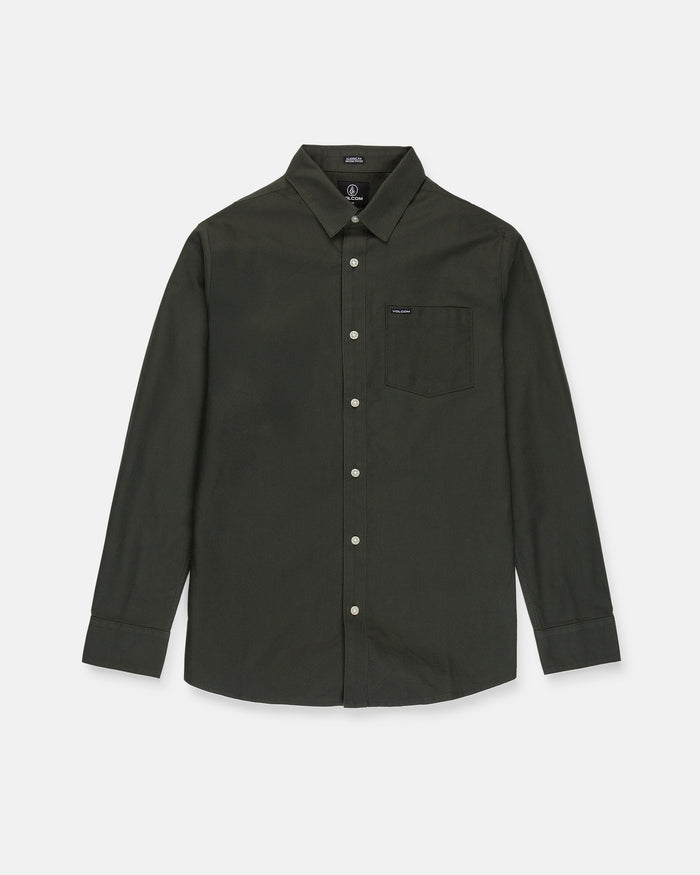 The Men's Veeco Oxford Long Sleeve Shirt by Volcom, shown in Climbing Ivy green, features a classic fit with a collar and single chest pocket, crafted from soft micro suede and displayed on a white background.