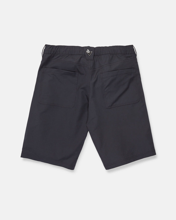 Back view of Volcom Men's Venture Stone Hybrid Shorts in Asphalt Black, crafted from recycled-poly fabric. The shorts feature two rear patch pockets, an elastic waistband, and a small black and white tag at the center back. Displayed against a plain white background.