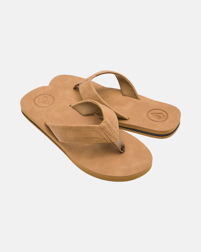 A pair of Volcom Men's Victor LX Sandals in tan with thick straps and textured soles featuring Recliner Comfort Foam, displayed overlapping on a white background.