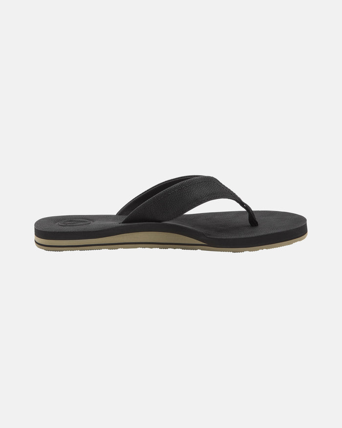 A side-profile of the Volcom Men's Victor LX Sandal is shown on a plain white background, featuring a black textured strap, slightly contoured sole, and Recliner Comfort Foam for lasting support.