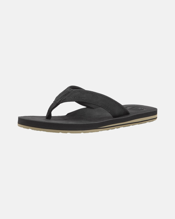 A black Volcom Men's Victor Sandals LX sandal features a textured fabric strap and slightly contoured Recliner Comfort Foam sole, displayed against a plain white background.