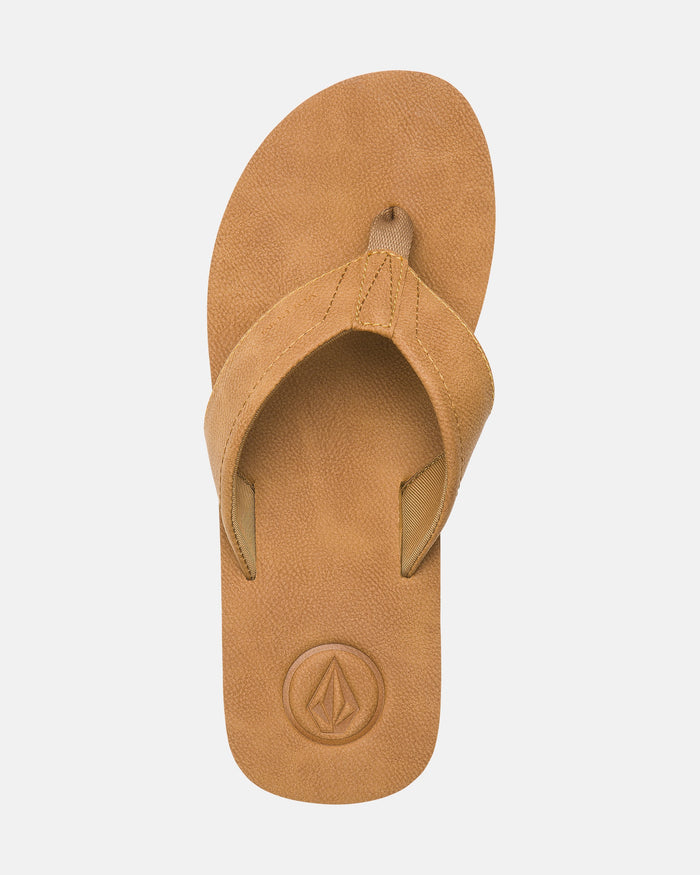 The Volcom Men's Victor Sandals LX feature a tan color, textured footbed, and wide strap with a circular embossed logo by the heel. These water-friendly sandals are shown on a plain white background.