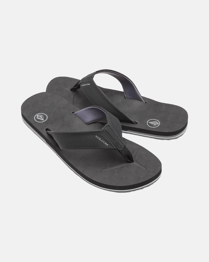 A pair of black Men's Victor Sandals by Volcom with textured soles, sturdy fabric straps, and Recliner Comfort Foam for support. These water-friendly sandals are shown on a plain white background.