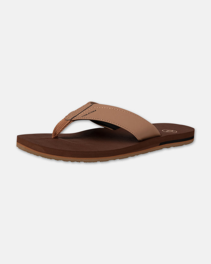 The Volcom Men's Victor flip-flop features a wide tan strap and textured insole, displayed on a plain white background.