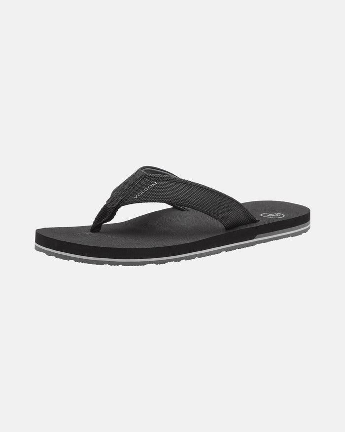 A single Volcom Men's Victor Sandal in black, featuring a textured fabric strap, cushioned Recliner Comfort Foam sole, and small logo on the footbed, displayed against a plain white background.