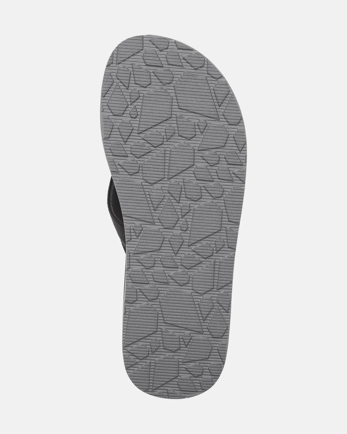 The image features the sole of the Men’s Victor Sandals by Volcom in gray, displaying a textured geometric tread pattern. Set against a white background, it highlights the water-friendly design of these sandals.