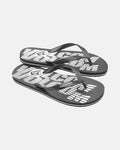 A pair of Volcom Volcomotion Mens flip-flops in black, featuring bold white graphic text and the Volcom logo on the footbeds, displayed on a white background.