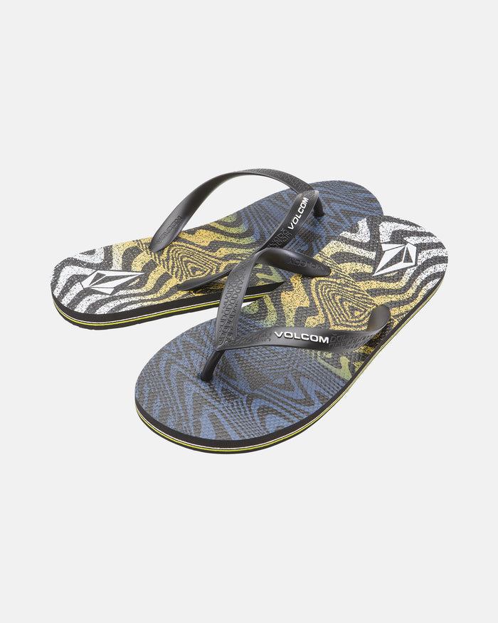 The Men's Volcomotion Mens flip-flops by Volcom feature black straps and a vibrant, abstract blue, yellow, and white wavy pattern on the soles—perfect for summer comfort and classic style. Displayed on a plain white background.