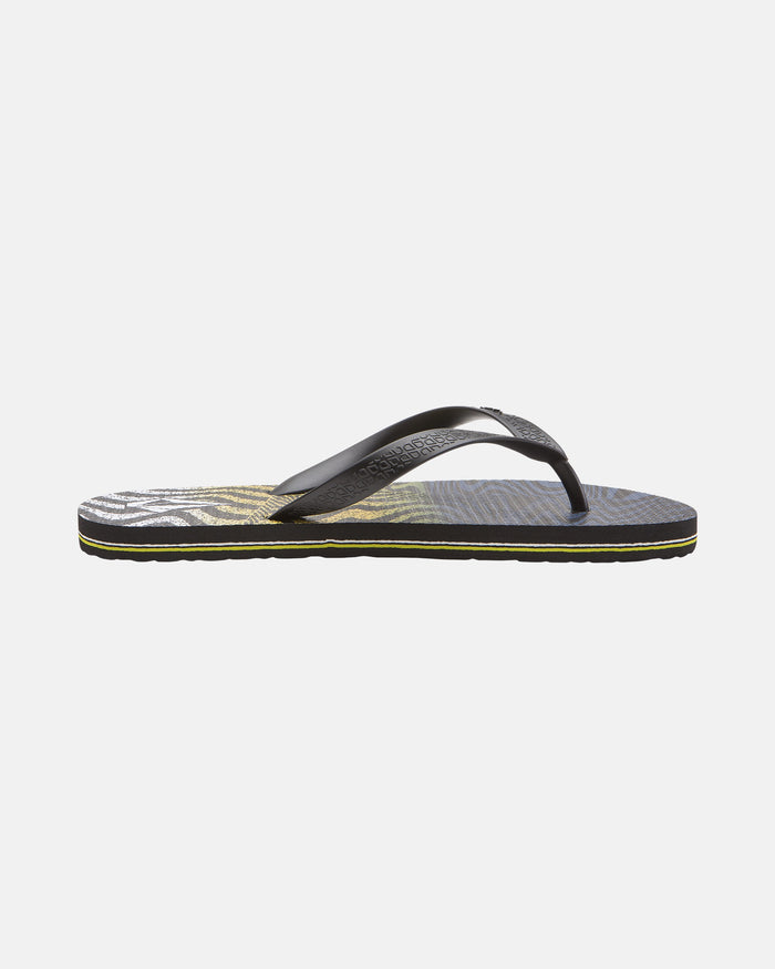 The Men's Volcomotion Mens flip-flop by Volcom features a printed footbed and black thong straps, shown in side profile on a white background—ideal for everyday comfort and signature style.