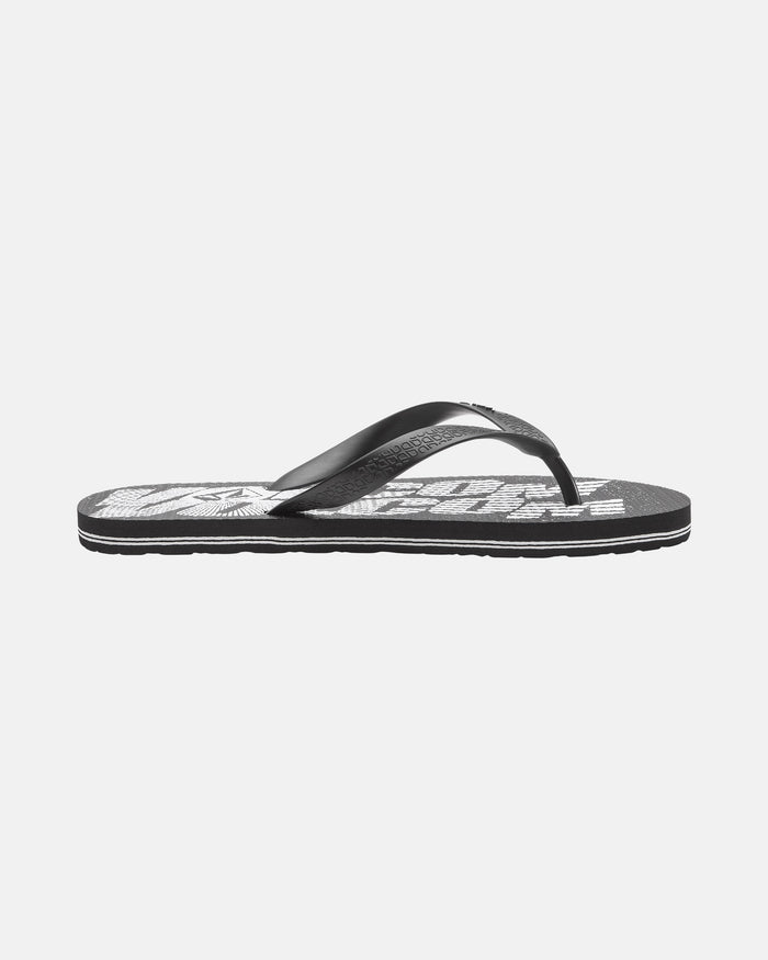 The Volcom Volcomotion Mens flip-flop sandal features a black design with a white graphic on the footbed, displayed in side profile against a plain white background.