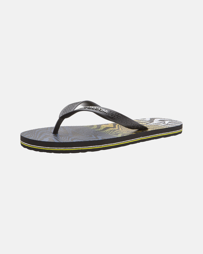 The Men's Volcomotion flip-flop by Volcom features a black, patterned sole, yellow trim, and a textured black thong strap with the Volcom logo—ideal for everyday comfort and signature style. Shown on a plain white background.