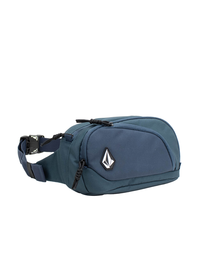The Men's Waisted Pack by Volcom features a blue design with a black zipper, adjustable strap, and a white Volcom logo patch on the front pocket, making it perfect for keeping your essentials hands-free during outdoor adventures. Shown against a white background.