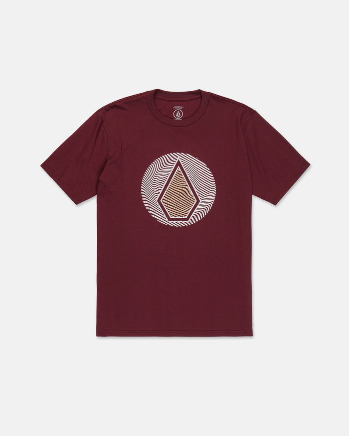 The Volcom Men's Wave Stone Short Sleeve Tee is a maroon t-shirt featuring a geometric design with a central diamond shape inside a white circular pattern on the chest, crafted from premium ring spun cotton for exceptional comfort and durability.