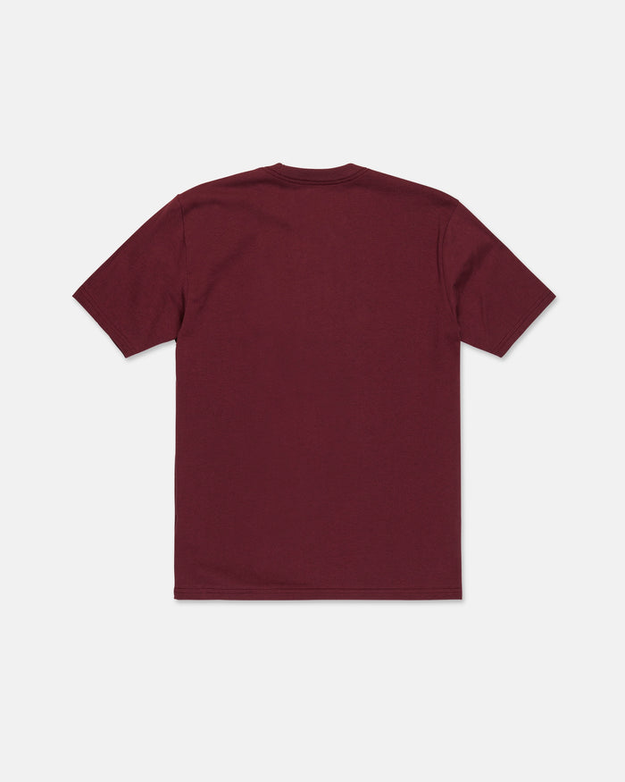 The Volcom Men's Wave Stone Short Sleeve Tee is shown laid flat with the back side facing up against a white background. This premium t-shirt is made from high-quality ring spun cotton and features a plain maroon color.