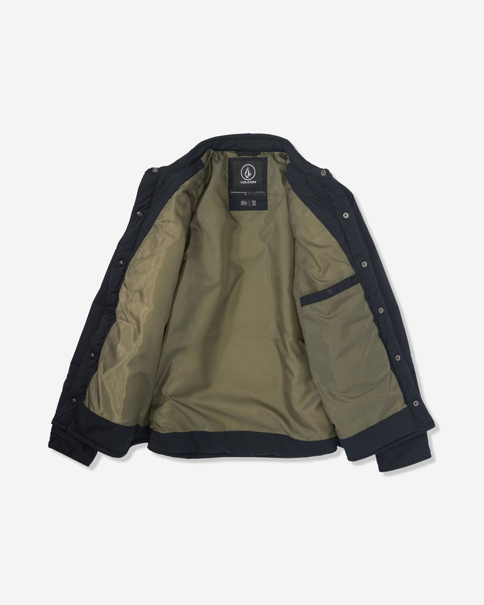 The Volcom Men's Westmead Quilted Jacket, shown open on a white background, features a light olive green inner lining, a left-side inner pocket, and front button closures.