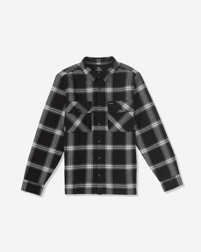 The Volcom Men's Wilderstone Long Sleeve shirt, in black and white plaid, is 100% cotton with a button-up front and two chest pockets, shown laid flat on a white background.