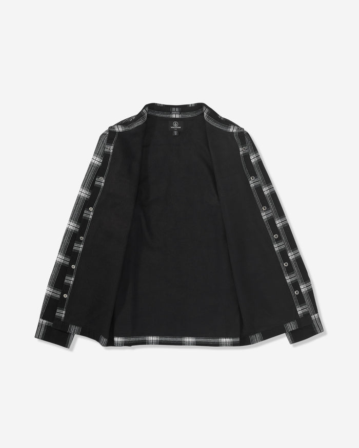 The Volcom Men's Wilderstone Long Sleeve is a black shirt with an open front, featuring black and white plaid accents along the edges and inner sleeves. Shirt is displayed laid flat on a white background.