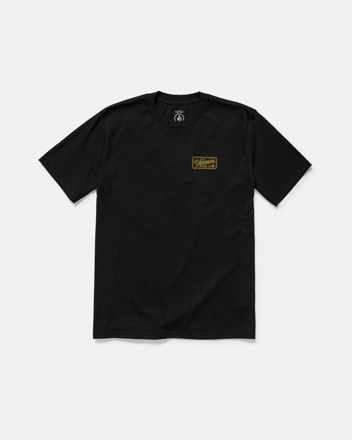 The Volcom Men's Wrecking Short Sleeve Tee is a classic fit, 100% cotton black tee with a small gold and black logo patch on the left chest, shown laid flat on a white background.