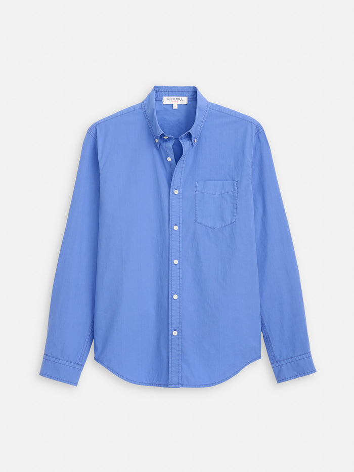 The Mill Shirt In Cotton Poplin is a blue, long-sleeve, button-down made from 100% cotton with a single chest pocket—perfect for any occasion.