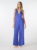blue v neck jumpsuit with tie back detail