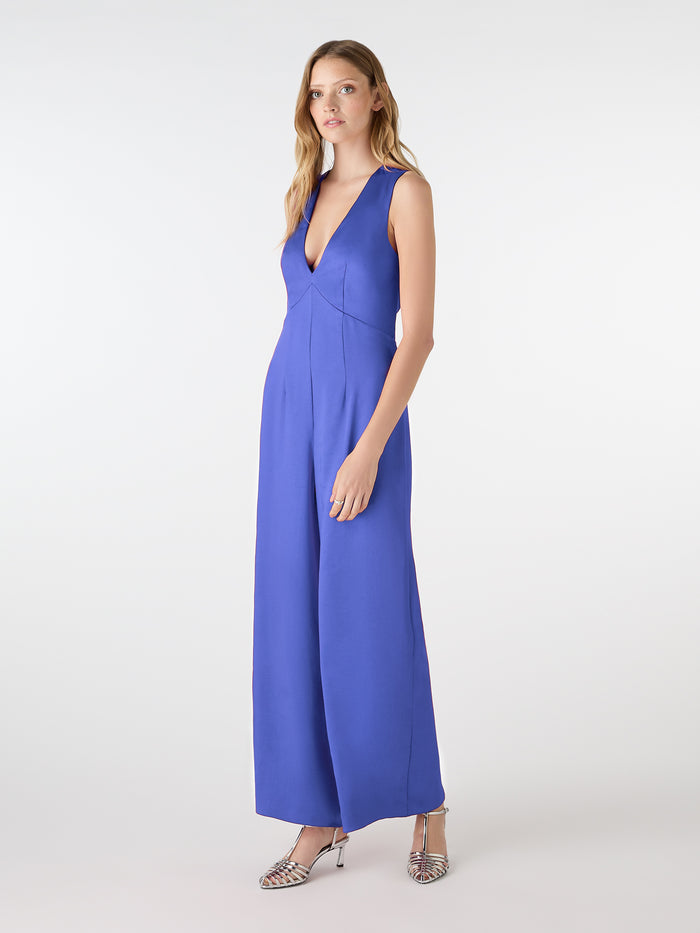 blue v neck jumpsuit with tie back detail