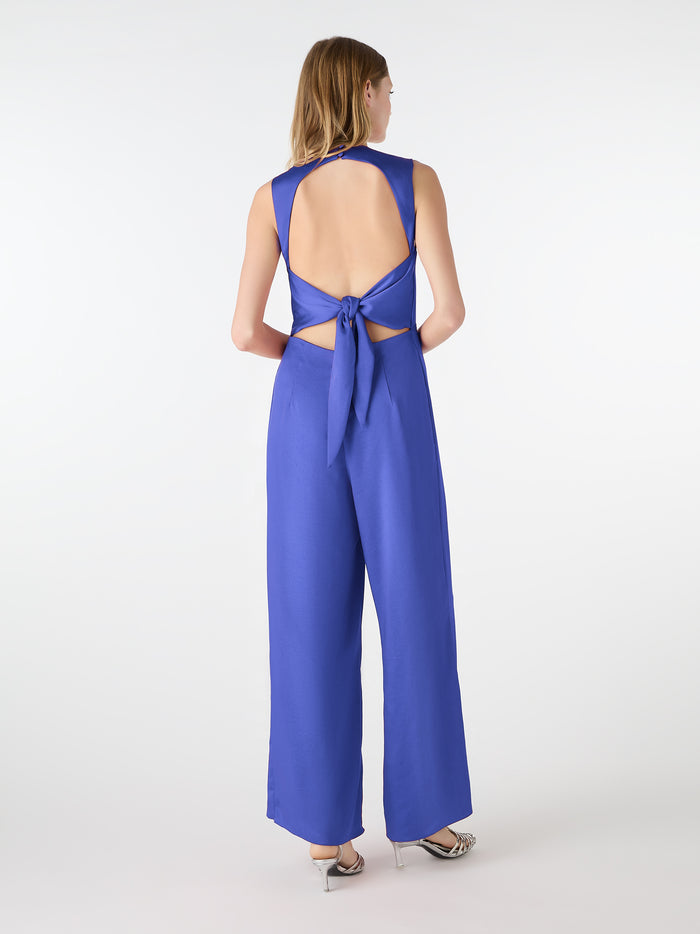 blue v neck jumpsuit with tie back detail
