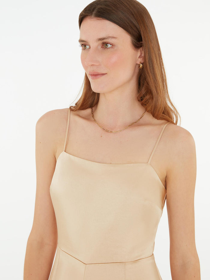 strappy jumpsuit in gold with tie back detail