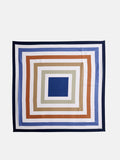 Pop Art Silk Scarf featuring concentric squares in blue, beige, white, and rust on a white background, finished with a dark blue border.