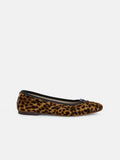 The Prince Street Ballet Flat in Calf Hair, handmade in Florence from luxurious Italian leather with a leopard print and finished with a small black bow on the toe, is shown from the side against a plain white background.