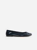 The Prince Street Ballet Flat is a shiny, dark blue Italian leather shoe with a small bow on the rounded toe and thin black trim, shown in side profile against a plain white background.