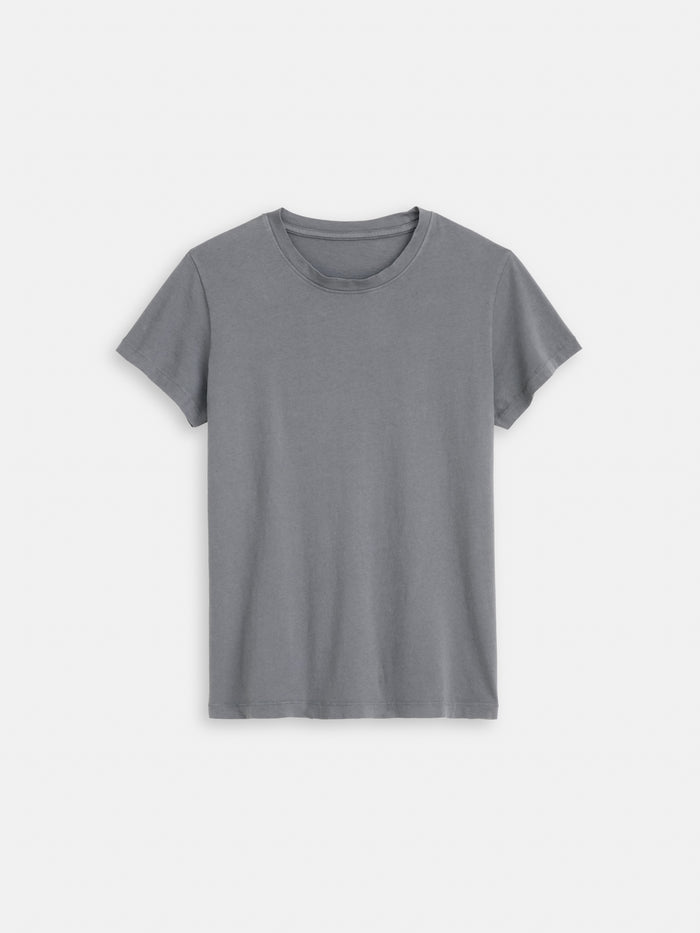 The Prospect Tee In Cotton Jersey is a plain, short-sleeved gray T-shirt with a round neckline and simple, casual design, made in Peru and shown laid flat on a white background.