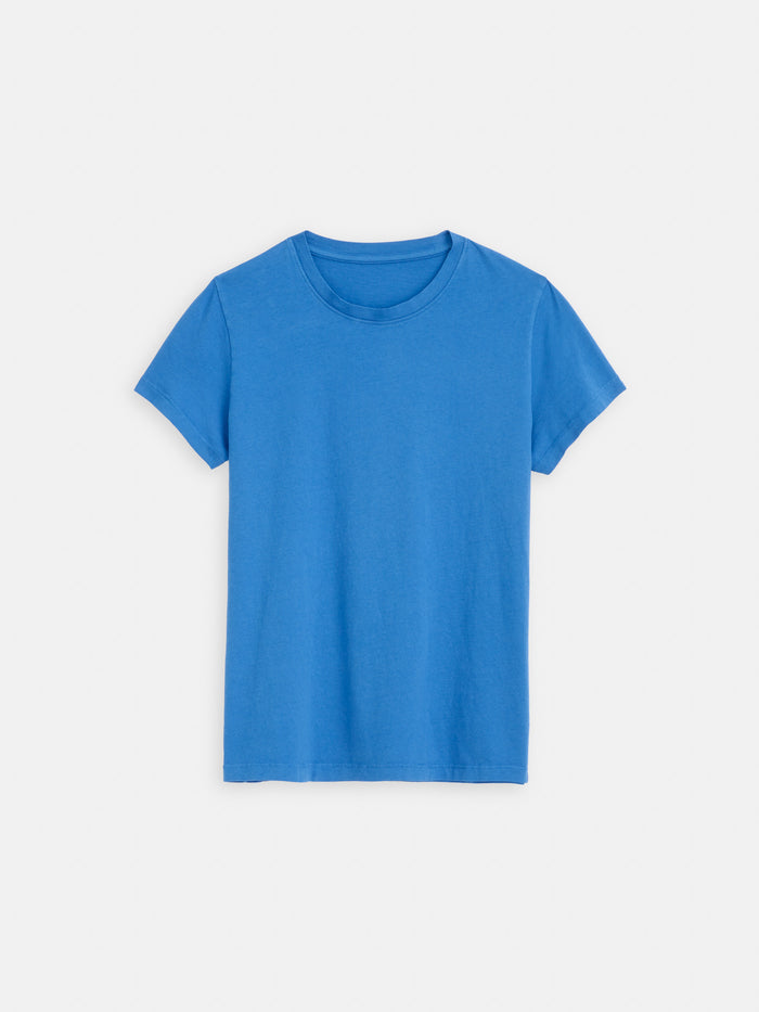 The Prospect Tee in Cotton Jersey, a plain blue short-sleeved T-shirt made from 100% cotton, is laid flat on a white background.