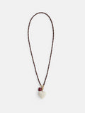 The Roxanne Assoulin Long Happy Cord Charm Necklace features a puffy white heart-shaped pendant, a smaller red heart charm near the clasp, and colorful dark brown cording.