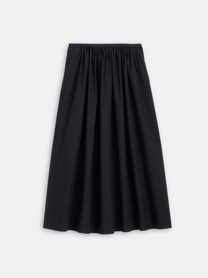 The Sarah Skirt in Cotton is a black, ankle-length A-line skirt with a gathered elastic waistband, shown against a plain white background.