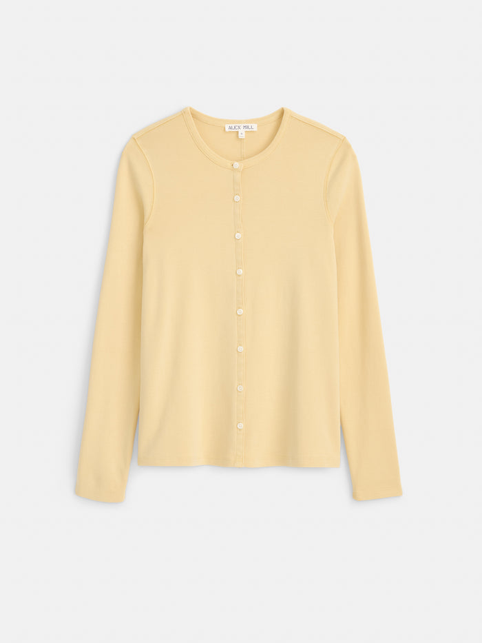 The Frankie Cardigan in Cotton Rib is a light yellow, long-sleeve, button-up cardigan with a round neckline, made from 100% cotton and garment-dyed for a rich finish, displayed flat against a white background.