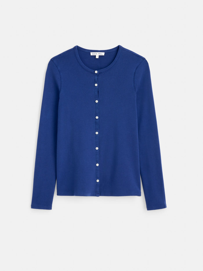 The Scout Cardigan in Cotton Rib is a long-sleeved, royal blue cardigan featuring a round neckline and pearl-like shell buttons down the front. Crafted from cotton rib fabric and garment-dyed for rich color, it is shown displayed flat on a white background.