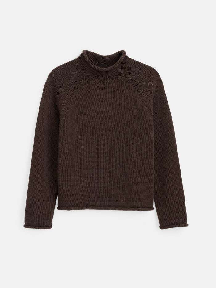 The Eastport Rollneck In Cotton is a plain, long-sleeve, dark brown knitted sweater with a mock neck, made from 100% cotton and displayed flat on a white background.