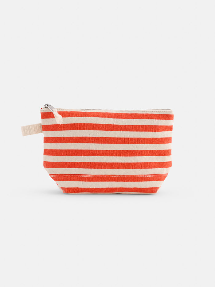 The Perfect Canvas Pouch in Stripe features red and beige horizontal stripes, a zippered closure, and a beige pull tab—ideal as a makeup bag or personalized pouch. Set against a plain white background.