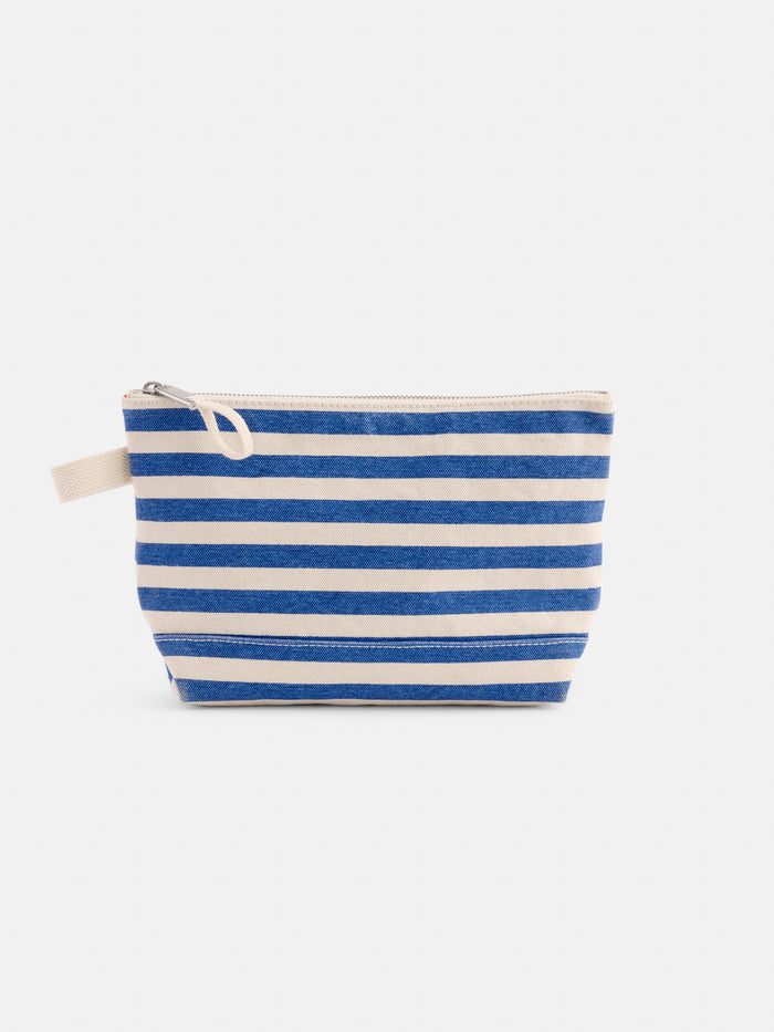 The Perfect Canvas Pouch in Stripe features horizontal blue and white stripes with a small fabric loop, ideal as a personalized pouch or makeup bag. Displayed against a plain white background.