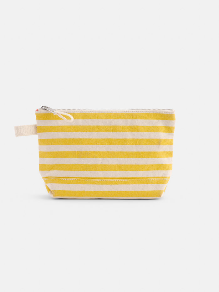 The Perfect Canvas Pouch in Stripe is a small pouch with horizontal yellow and white stripes and a fabric loop on one side, shown against a plain white background.