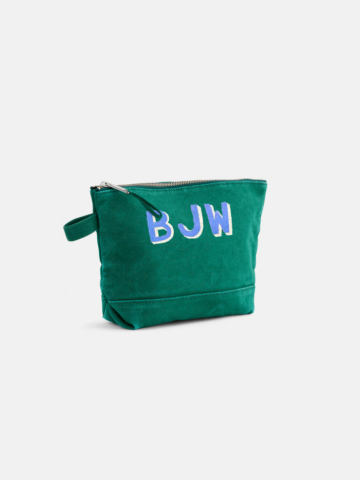 The Perfect Canvas Pouch is a durable makeup bag with a small side handle, featuring the initials BJW in large light blue and white letters on the front for personalized style and practicality.