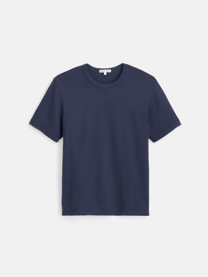 The Standard T-Shirt In Slub Cotton is displayed from the front against a white background. Crafted from breathable slub cotton, this plain navy blue short-sleeve men’s tee provides comfort and versatility for everyday wear.