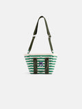 Introducing The Striped Mini: a compact tote bag crafted from green and white striped cotton canvas, featuring dark green handles, an adjustable shoulder strap, and a prominent “M” monogram on the front. This charming accessory is displayed against a simple white background.
