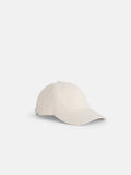 The Washed Canvas Baseball Cap in light beige features a curved brim, stitched eyelets, and an adjustable back strap, shown against a white background.